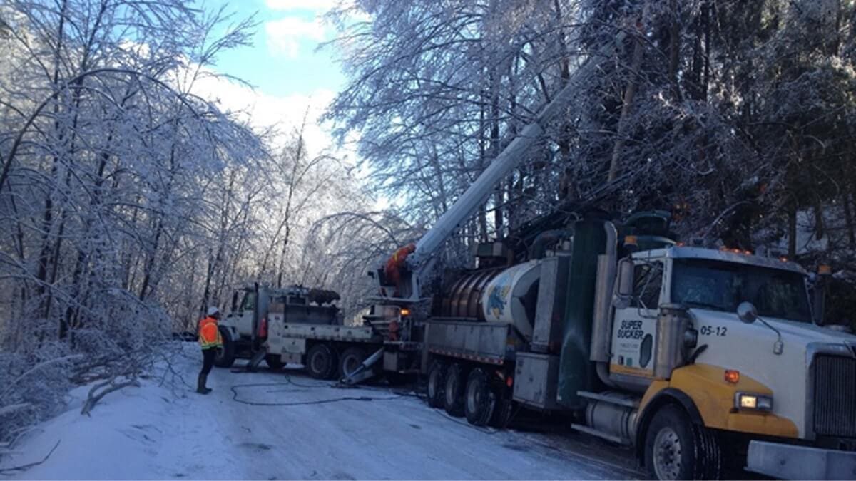 Cutting down branches after ice storm