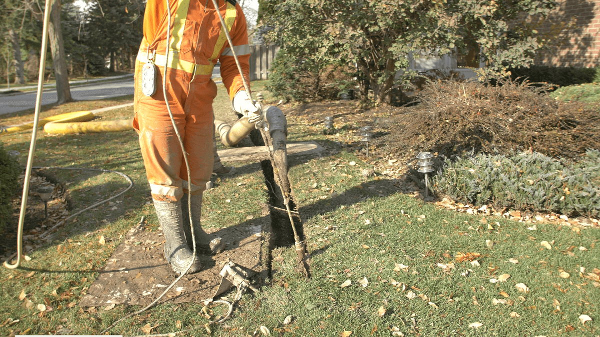 technician examining ground